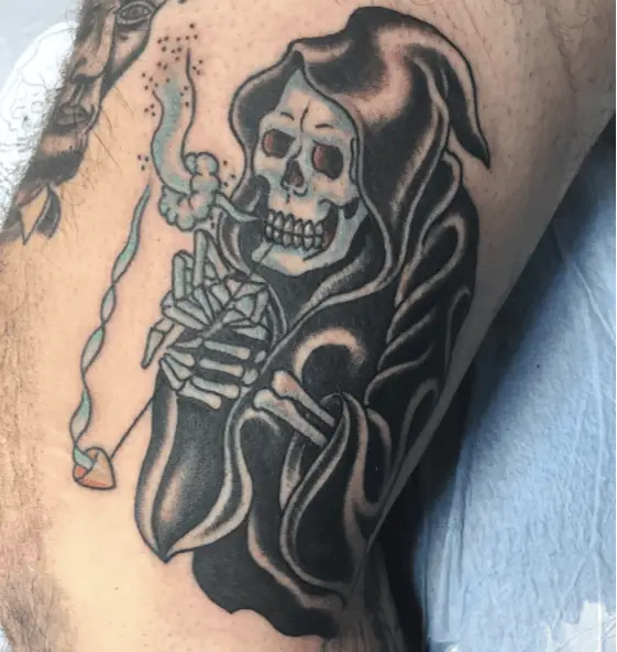 Blue Grim Reaper Exhaling the Smoke of Tobacco Pipe Tattoo