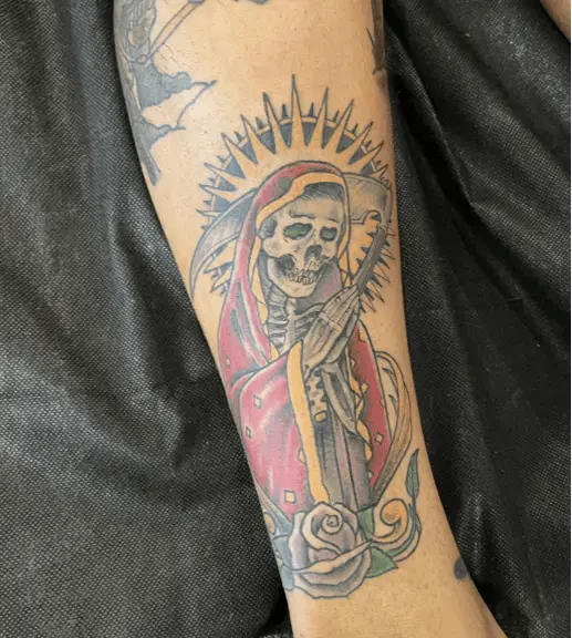 Santa Muerte Head Bowing and Praying With A Rose Colored Tattoo