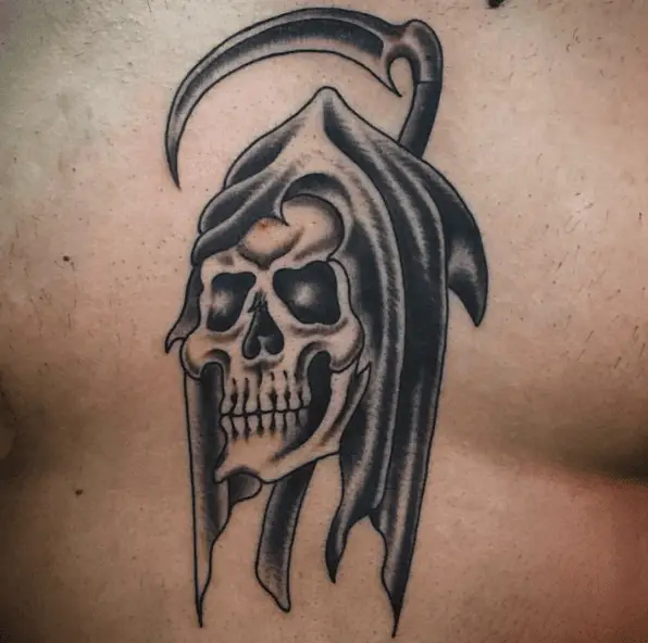 Grim Reaper Head in Front of the Scythe Tattoo