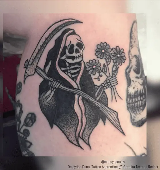 Grim Reaper Holding a Flowers Tattoo