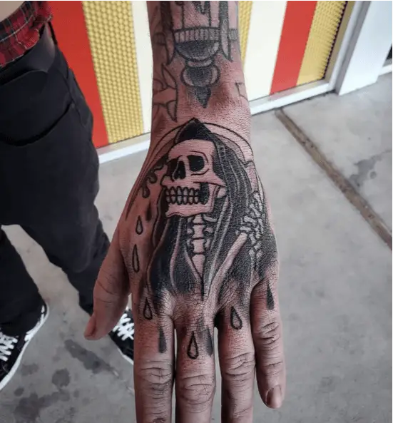 Look up Grim Reaper With Droplets Tattoo