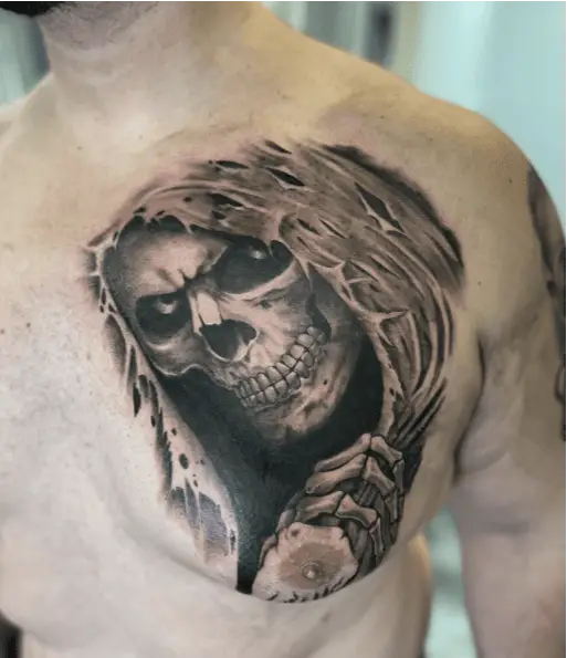 A Skull Holding Tattered Hood Tattoo