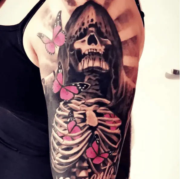 Pink Butterflies Flying Around the Hooded Skeleton Tattoo