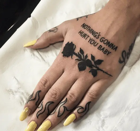 Bold Black Ink Rose Hand Tattoo