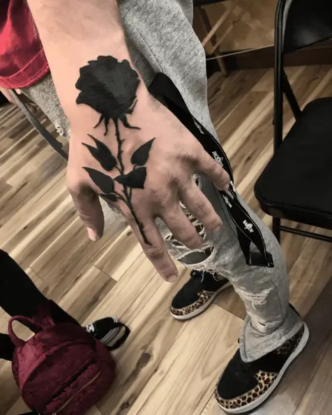 Bold Ink Black Rose Hand Tattoo