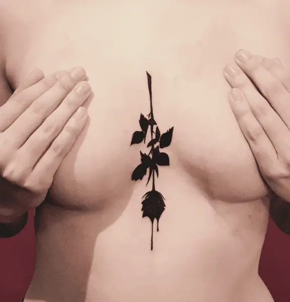Dripping Black Rose Sternum Tattoo