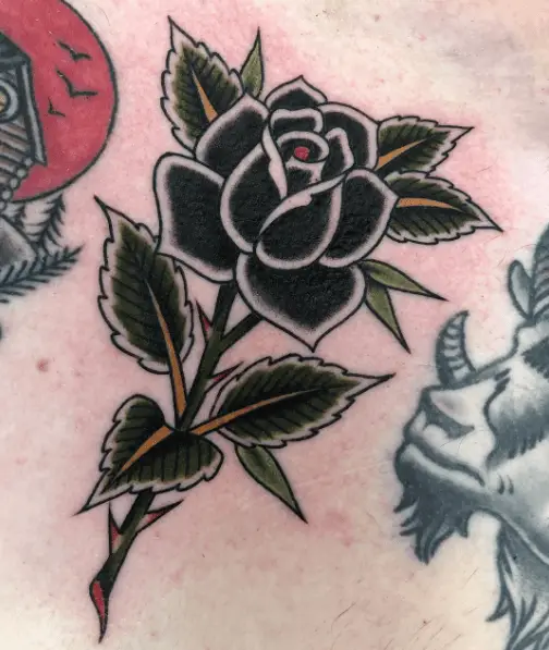 Black Rose with Green Leaves Tattoo