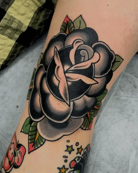 Black and Grey Rose with Colored Leaves Tattoo