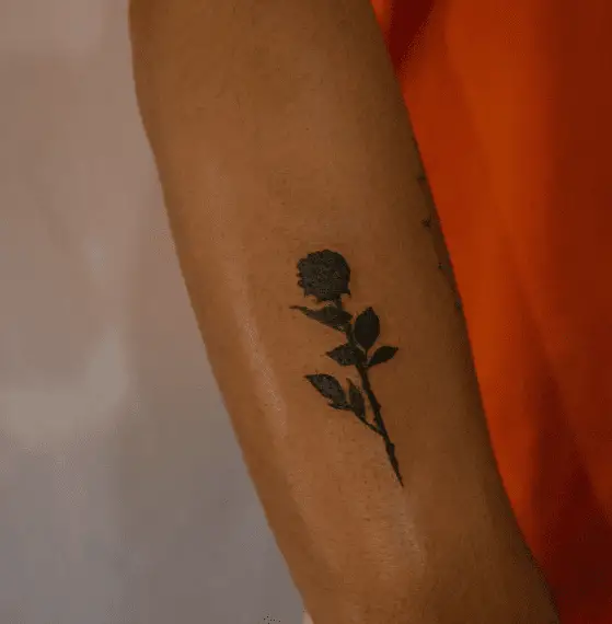 Small dark Rose Forearm Tattoo