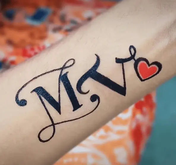 M and V Initials with Red Heart Tattoo