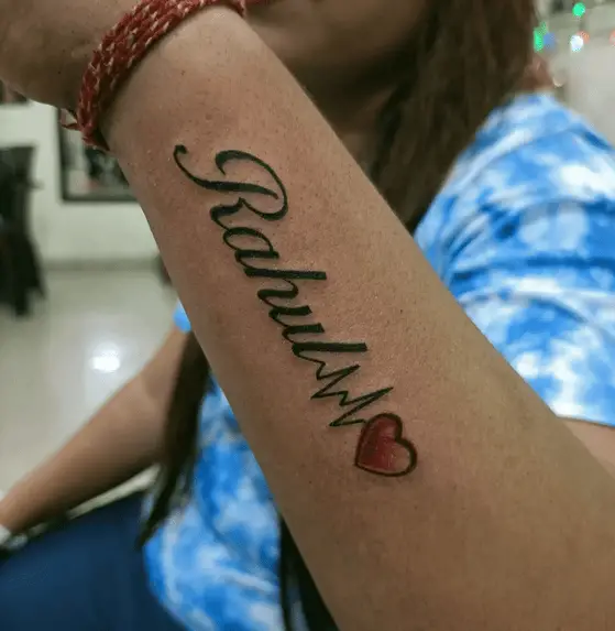 Name Rahul with Heartbeat Forearm Tattoo
