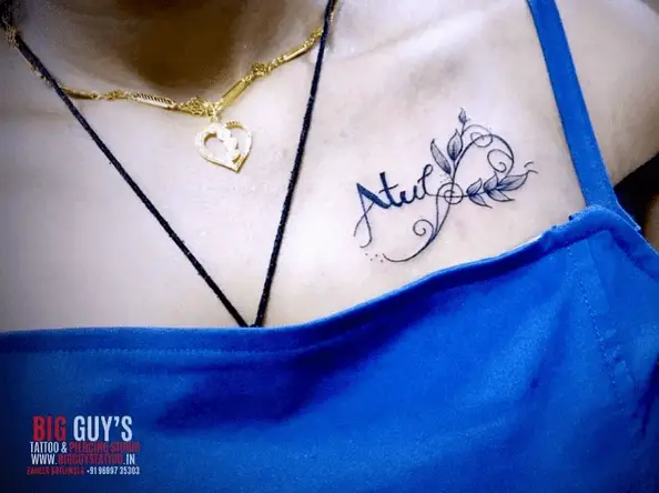 Name with Leaves and Infinity Chest Tattoo