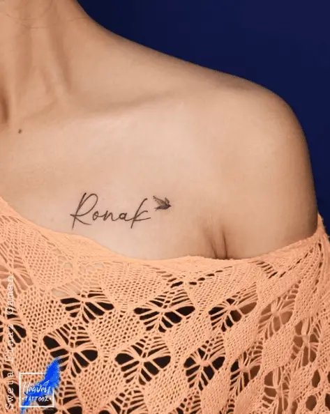 Name with Tiny Bird Chest Tattoo