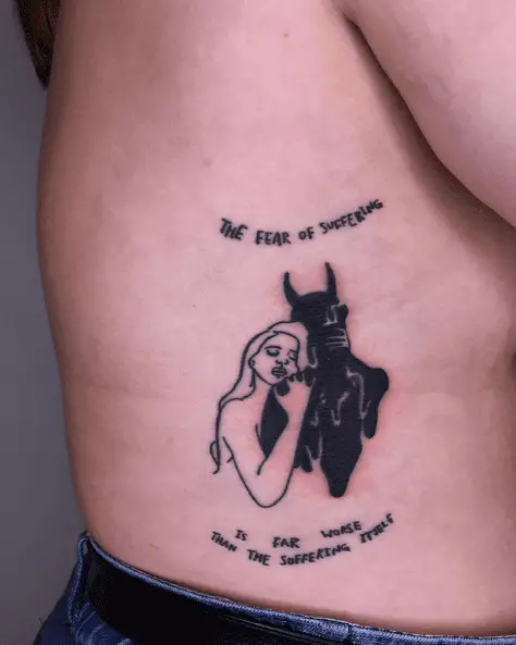 Woman Hugging Devil Graphical and Lettering Tattoo