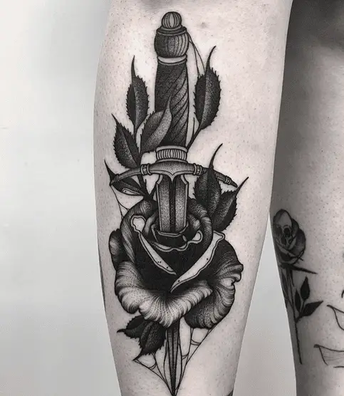 Rose Stabbed with Dagger Leg Tattoo