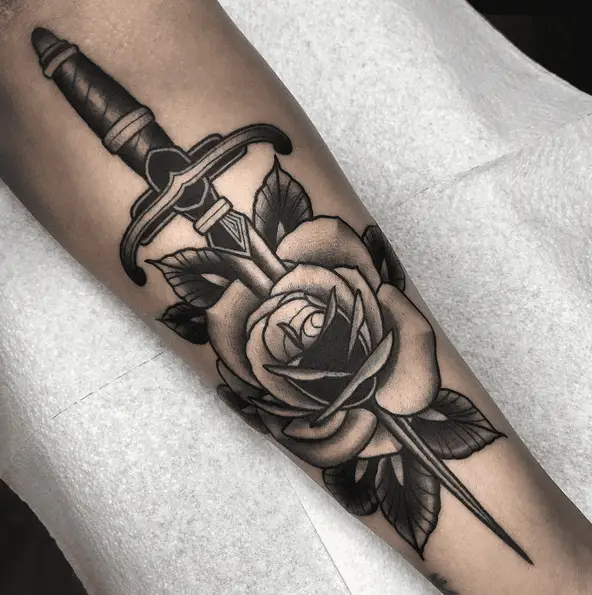 Grayscale Rose and Dagger Forearm Tattoo 