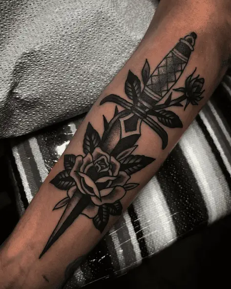 Black Rose Stabbed with Dagger Tattoo