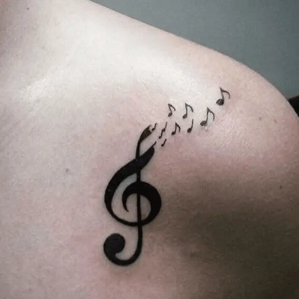 Large Music Note with Tiny Music Notes Shoulder Tattoo