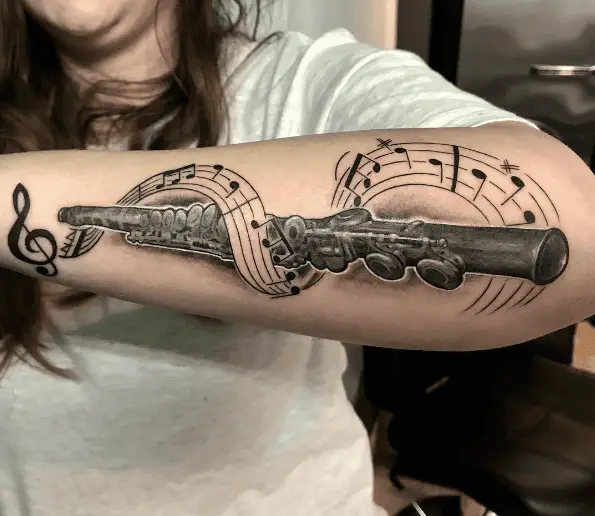 Music Note and Flute Forearm Tattoo