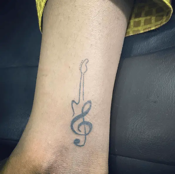 Guitar Shaped Music Note Tattoo