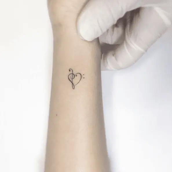 Heart Shaped Tiny Music Note Tattoo