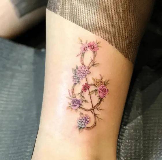 Multiple Colored Florals Music Note Tattoo