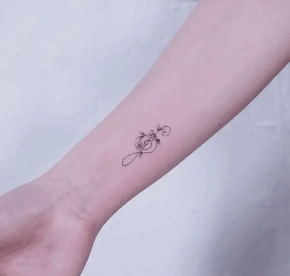 Tiny Floral Music Note Wrist Tattoo