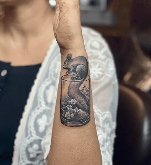 Squirrel Jumping Over Floral Glass Tattoo