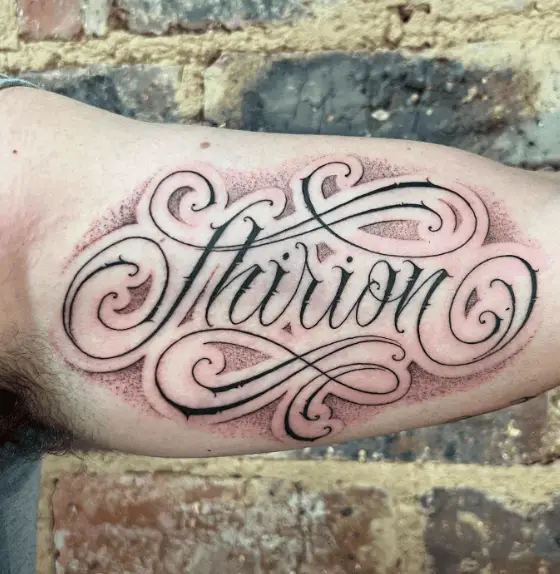 “Thirion” Cursive Style Lettering Tattoo