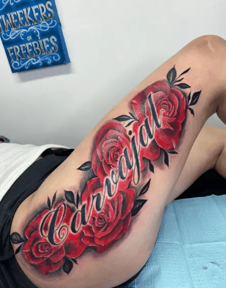 Last Name with Red Roses Thigh Tattoo