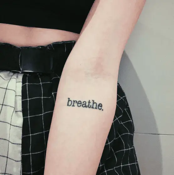 Bold Ink Breathe Text Tattoo