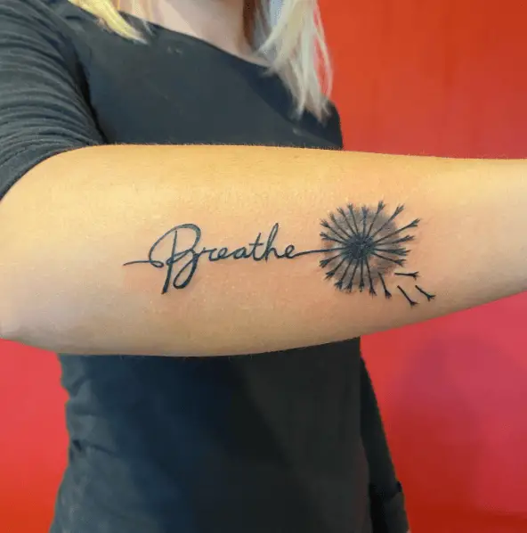 Breathe Lettering with Dandelions Forearm Tattoo