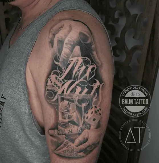 Black and Grey Gambling Theme Arm Tattoo